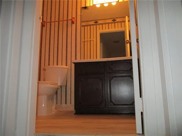 a view of a door with wooden floor
