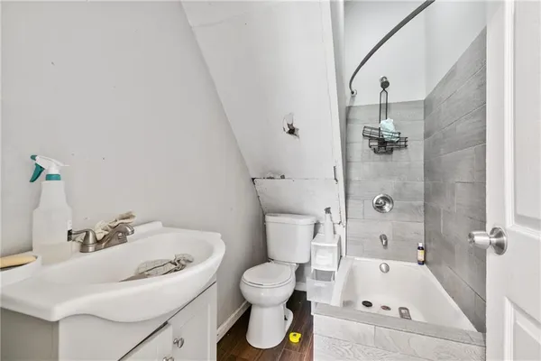 a bathroom with a sink and toilet