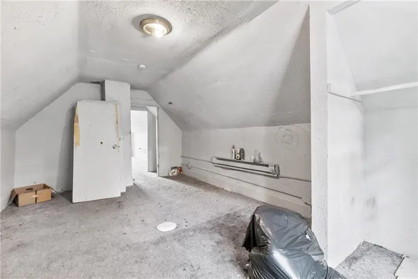 a kitchen with cabinets and a stove