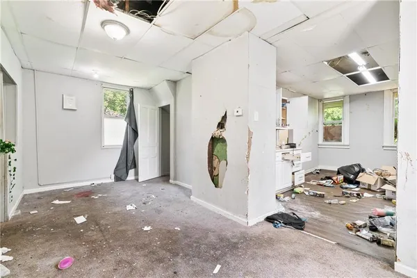 a view of a livingroom with furniture and a projector