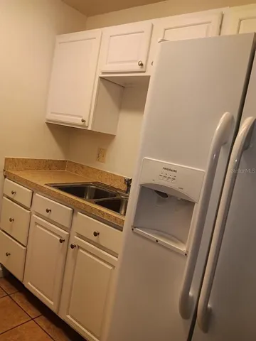 a view of a storage and utility room with washer and dryer
