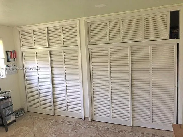 a view of a room with windows