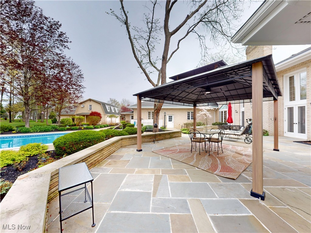 9870 Hobart Road Willoughby, OH 44094 - Photo 49 of 50 View of patio featuring outdoor dining space, a gazebo, and an outdoor pool