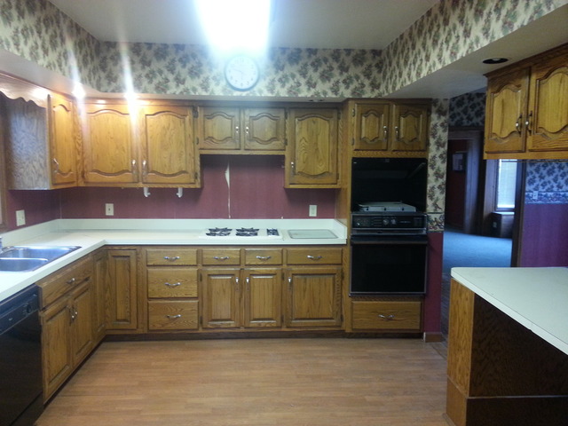 1021 Webster Street Ottawa, IL 61350 - Photo 6 of 11 a kitchen with stainless steel appliances granite countertop a stove a sink and a microwave