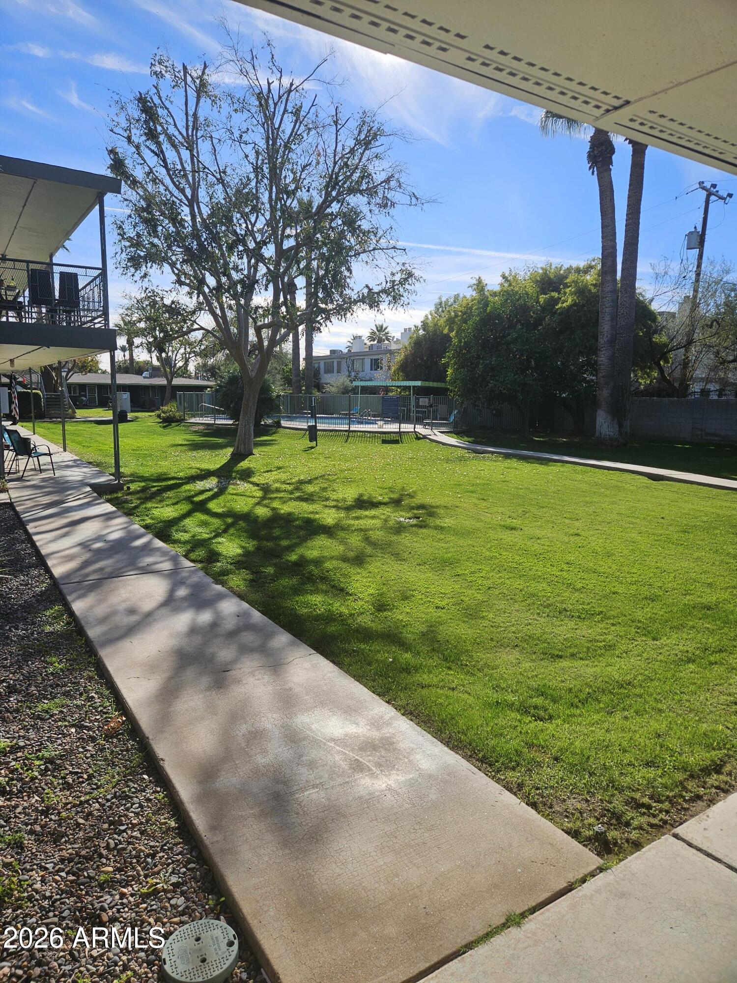 1418 East Osborn Road, Unit 25A Phoenix, AZ 85014 - Photo 13 of 13 a view of a backyard with a garden
