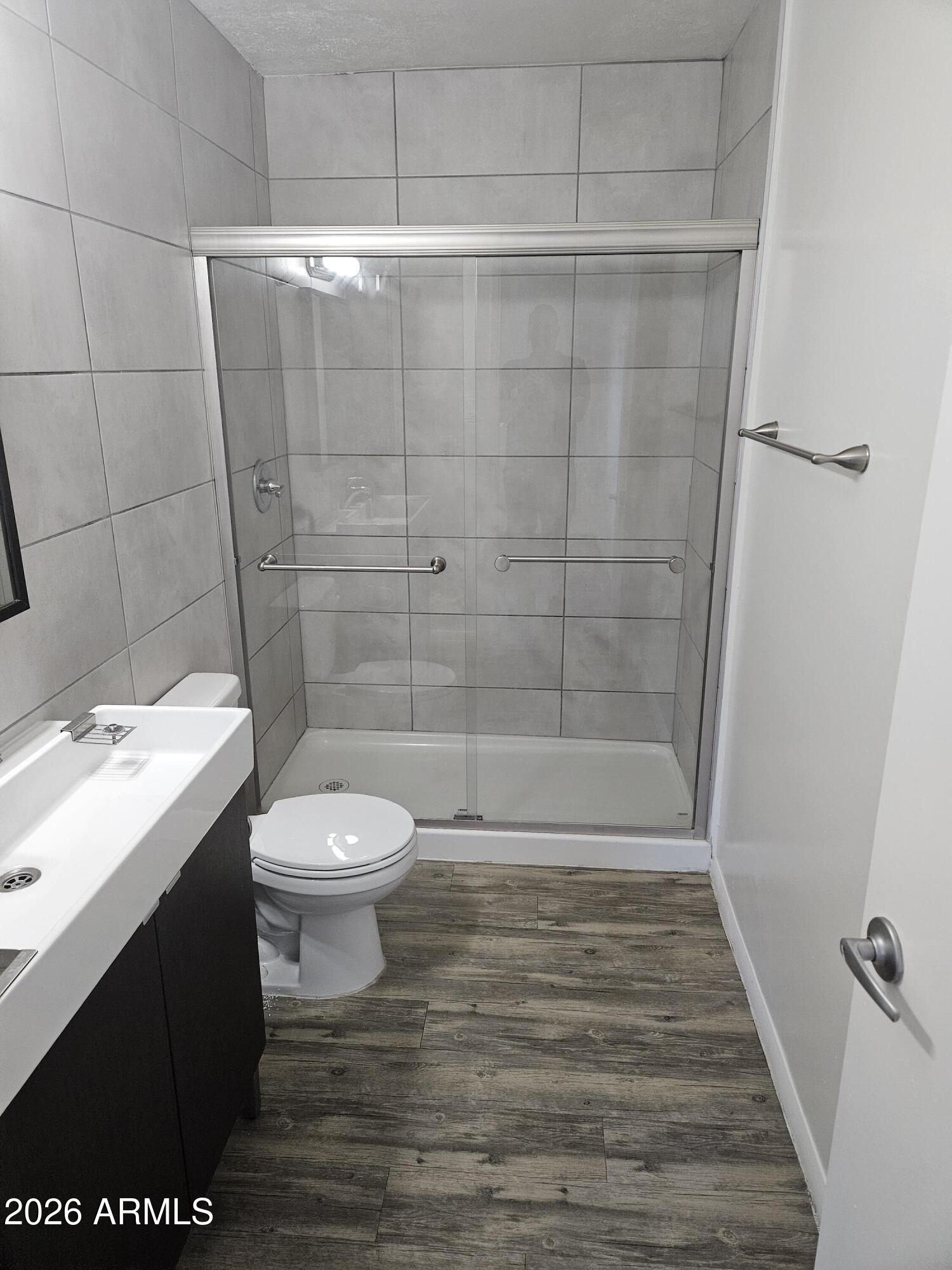 1418 East Osborn Road, Unit 25A Phoenix, AZ 85014 - Photo 10 of 13 a bathroom with a sink and a toilet
