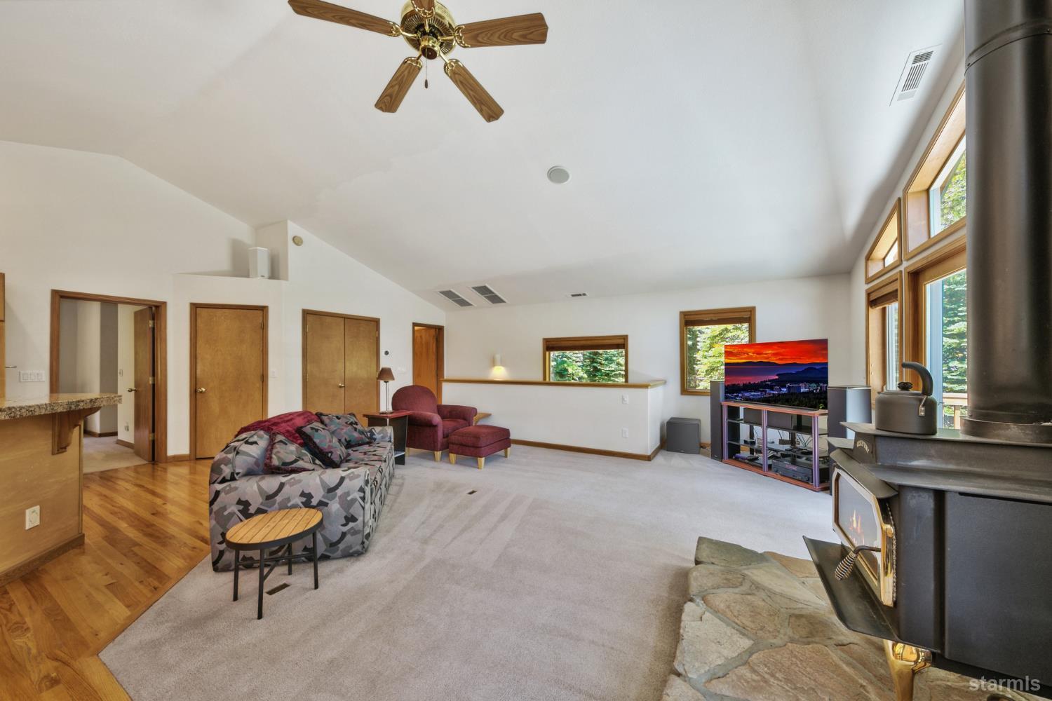34235 Fremont Road Kirkwood, CA 95646 - Photo 10 of 31 a living room with furniture and a flat screen tv