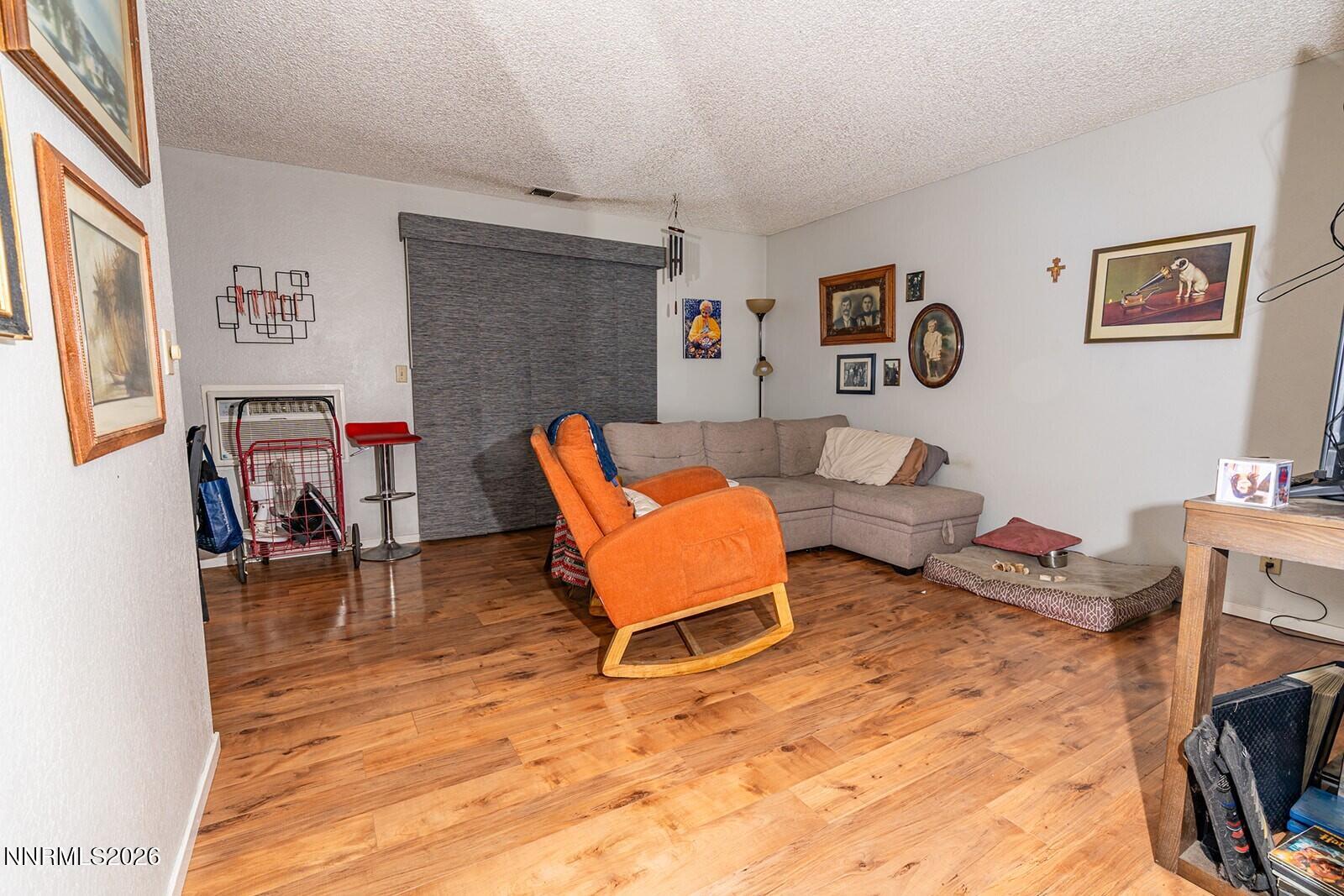 4608 Neil Road, Unit 215 Reno, NV 89502 - Photo 12 of 22 a living room with furniture and a fireplace