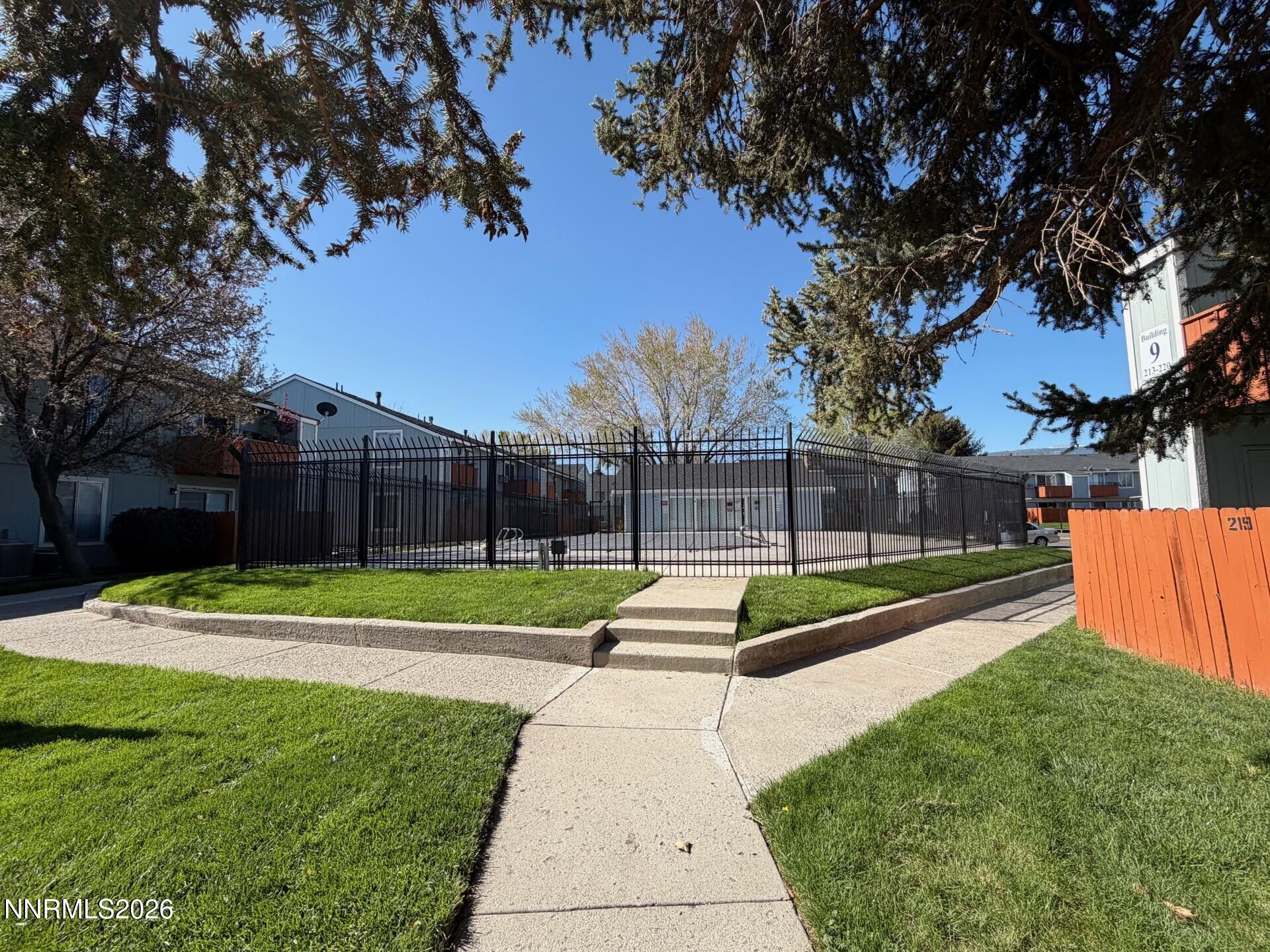 4608 Neil Road, Unit 215 Reno, NV 89502 - Photo 21 of 22 a view of backyard with green space