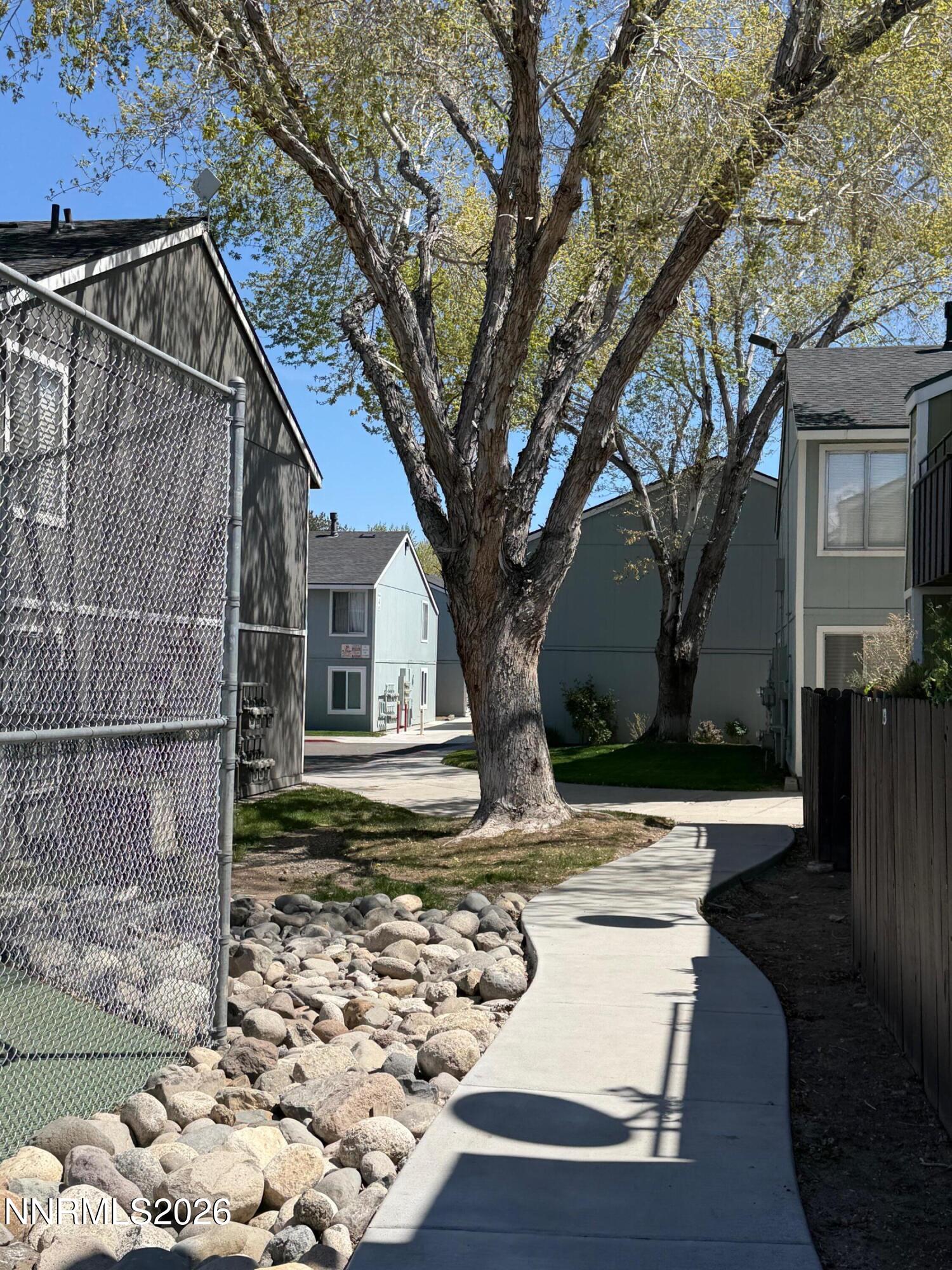 4608 Neil Road, Unit 215 Reno, NV 89502 - Photo 7 of 22 a view of a house with a yard