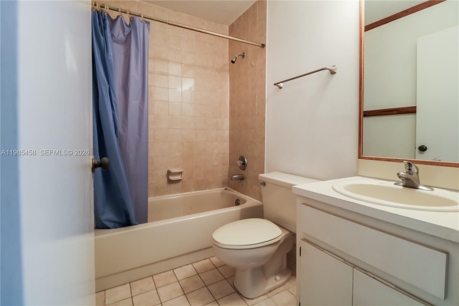 12955 Southwest 66th Lane, Unit 2122 Miami, FL 33183 - Photo 12 of 16 a bathroom with a sink a toilet and a bathtub