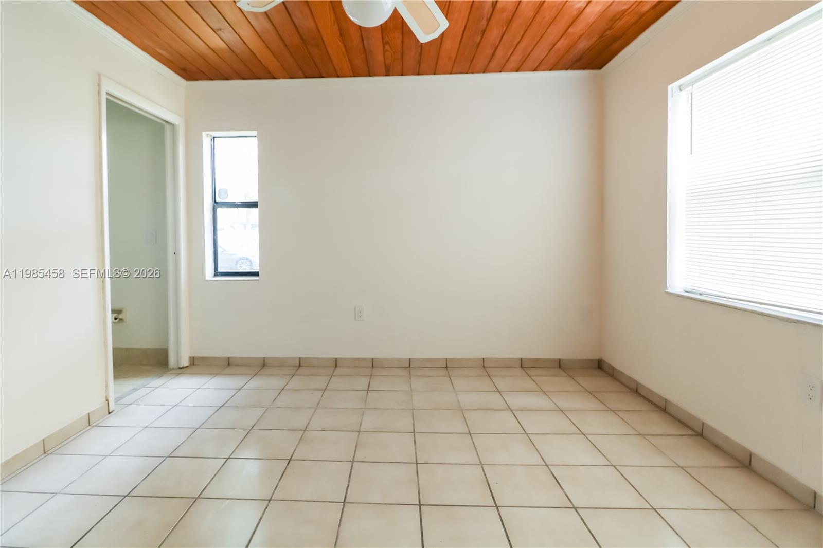 12955 Southwest 66th Lane, Unit 2122 Miami, FL 33183 - Photo 14 of 16 a view of an empty room and window