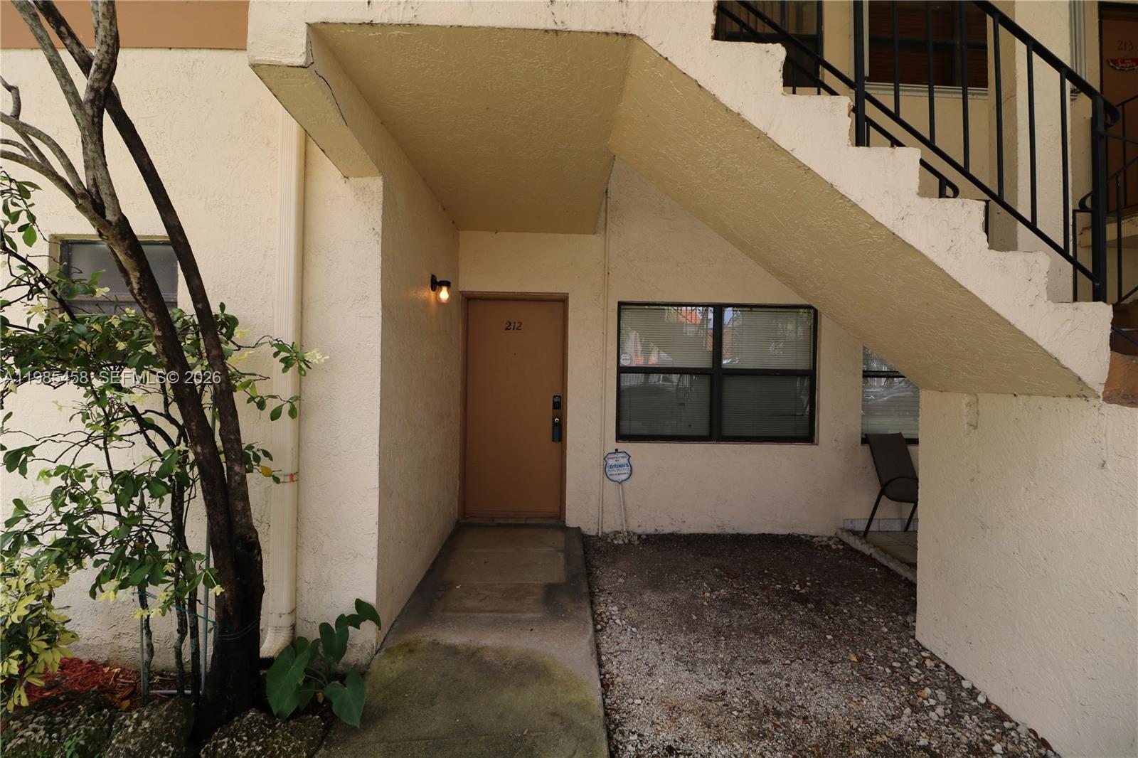 12955 Southwest 66th Lane, Unit 2122 Miami, FL 33183 - Photo 3 of 16 a view of a entryway of the house