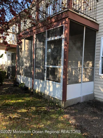 a view of a house with a small yard