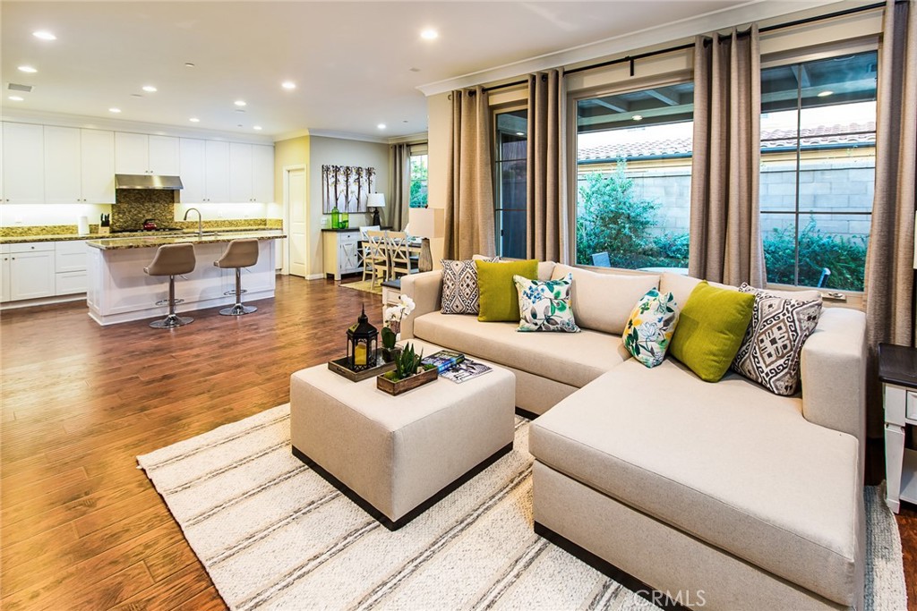 75 Gardenstone Path Irvine, CA 92620 - Photo 3 of 65 a living room with furniture and kitchen view