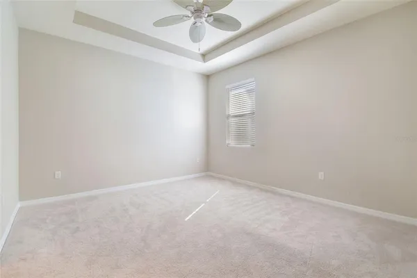 a kitchen with white cabinets and a sink