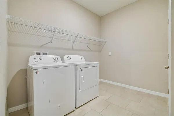 a bathroom with a toilet sink vanity and mirror