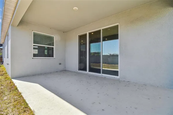 a bathroom with bathtub and window