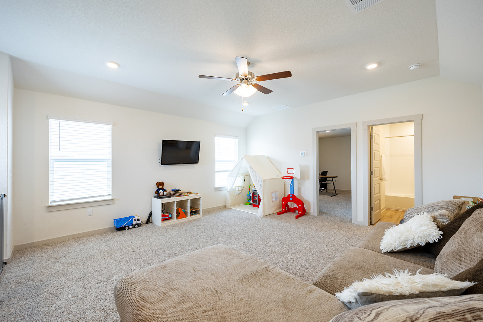 900 Balsora Cove Georgetown, TX 78628 - Photo 22 of 39 A versatile bonus room offers ample space for recreation and relaxation, complete with abundant natural light.