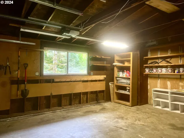 a view of an empty room with a garage