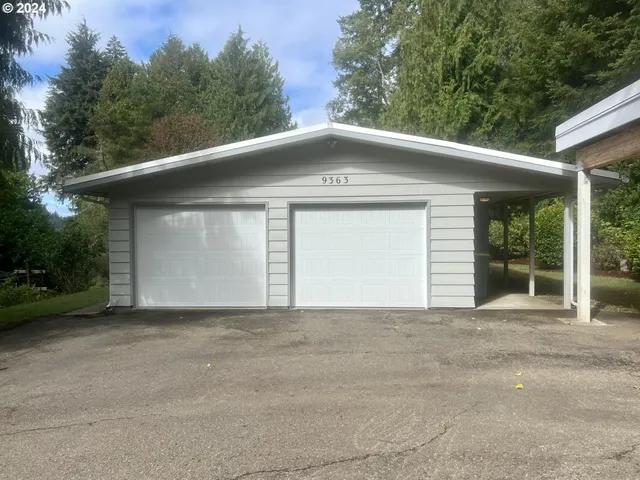 a front view of a house with a garage