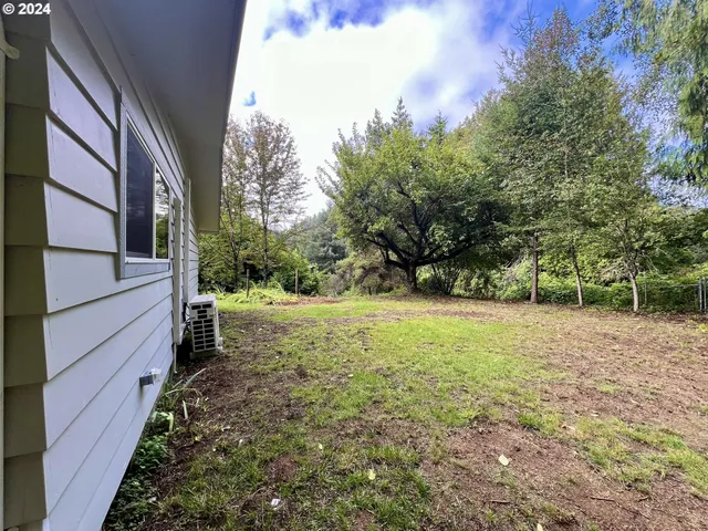 a backyard of a house with lots of green space