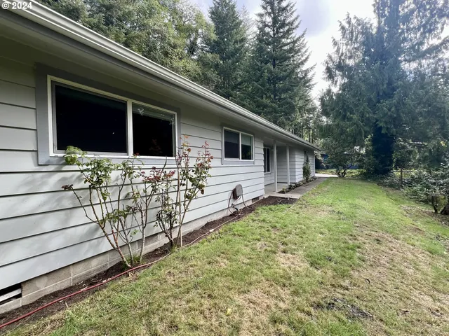 a backyard of a house with lots of green space