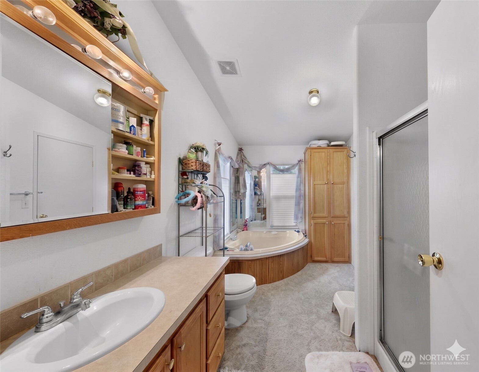 7928 Portal Way Custer, WA 98240 - Photo 23 of 39 a bathroom with a granite countertop sink and a mirror