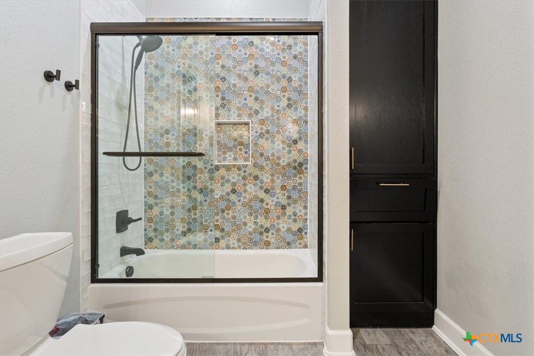 10940 Wedel Cemetery Road Rogers, TX 76569 - Photo 24 of 48 a bathroom with a shower and a toilet