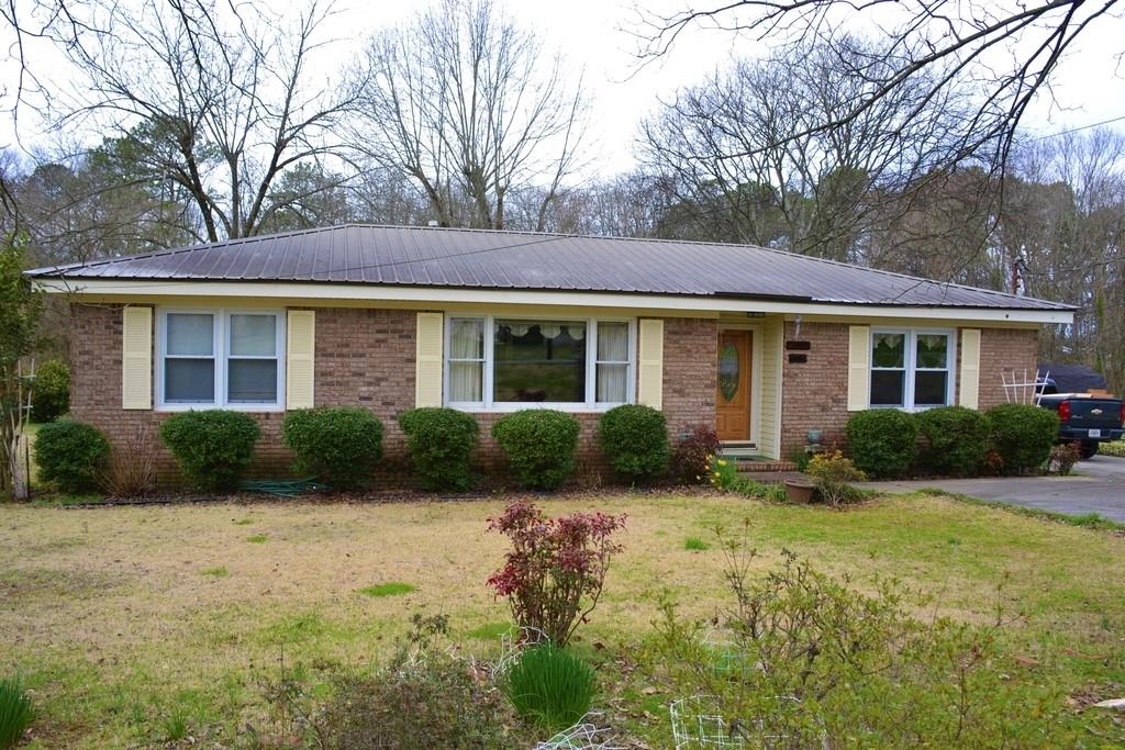 2602 Maple Road Southeast Rome, GA 30161 - Photo 1 of 1 a view of a house with a yard and plants