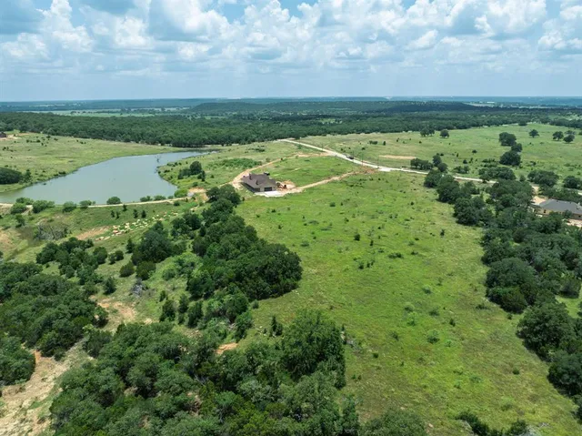 a view of a field with an ocean