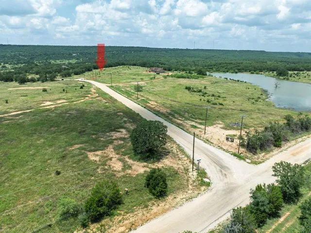 a view of a field with an ocean