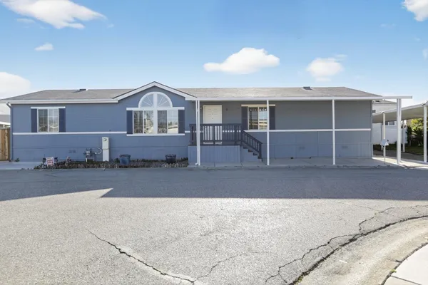 a front view of a house with parking space
