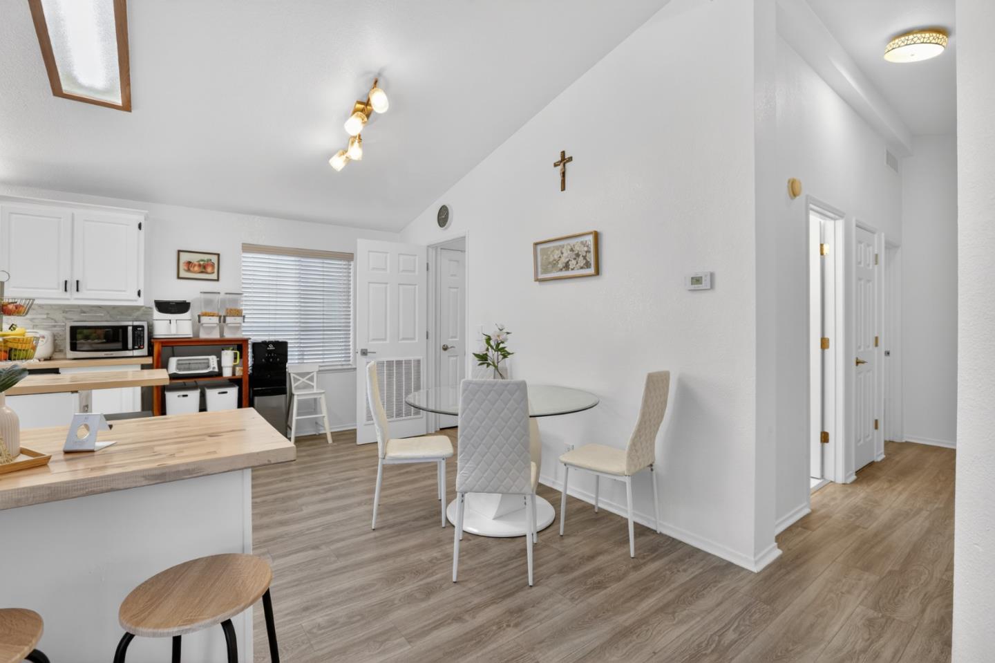 120 Dixon Landing Road, Unit 9 Milpitas, CA 95035 - Photo 17 of 34 a dining room with wooden floor and stainless steel appliances
