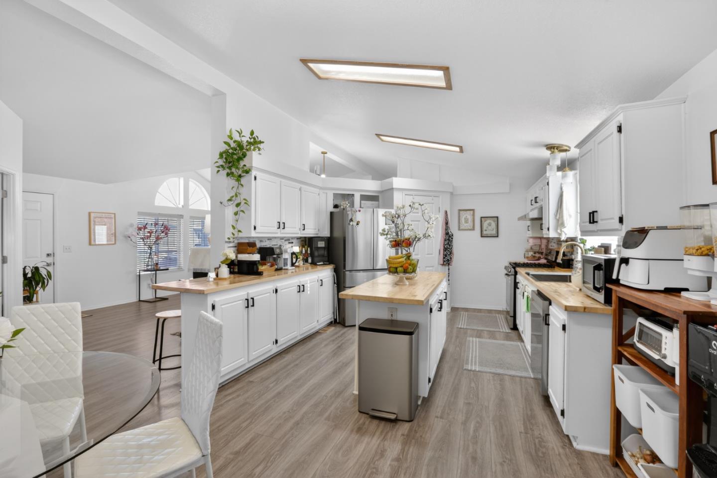 120 Dixon Landing Road, Unit 9 Milpitas, CA 95035 - Photo 18 of 34 a kitchen with white cabinets and appliances