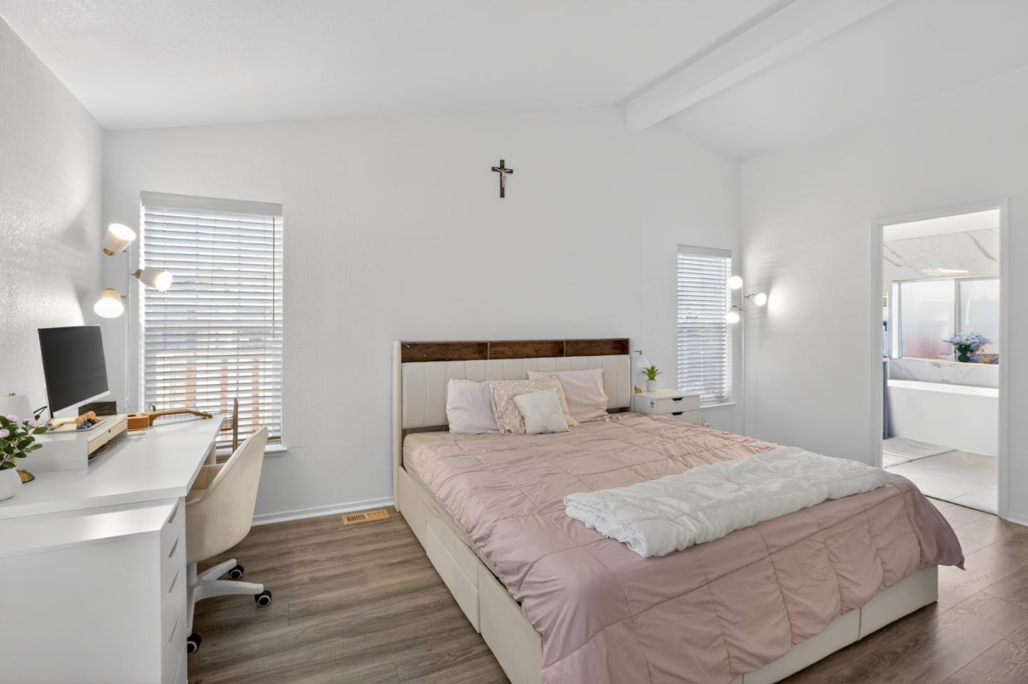 120 Dixon Landing Road, Unit 9 Milpitas, CA 95035 - Photo 22 of 34 a bedroom with a bed and a computer on the desk