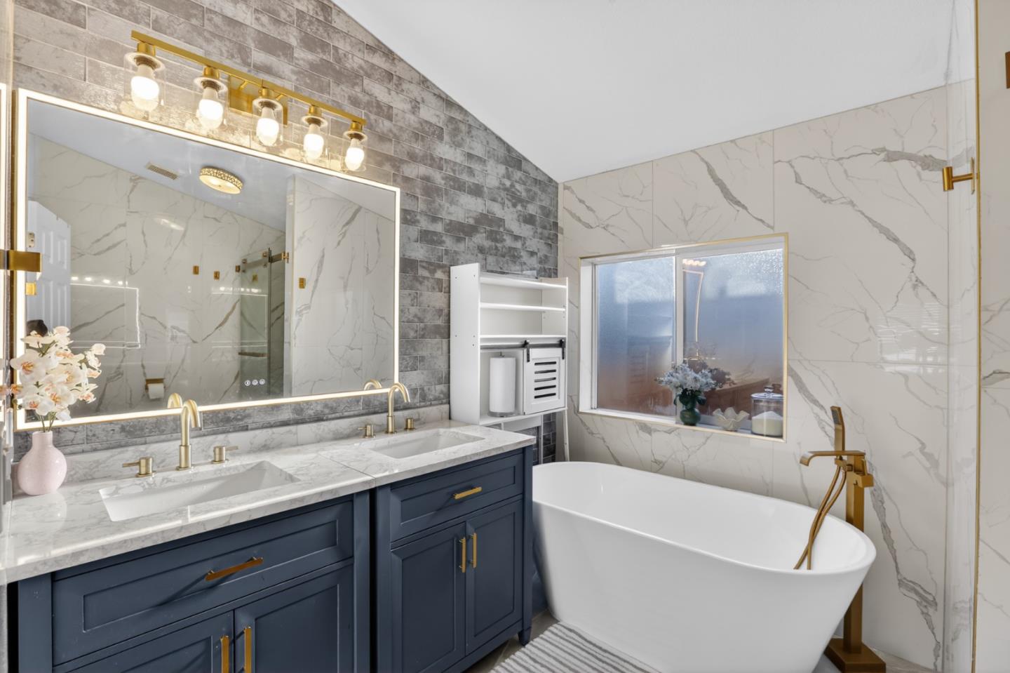 120 Dixon Landing Road, Unit 9 Milpitas, CA 95035 - Photo 28 of 34 a bathroom with a double vanity sink and mirror with bathtub