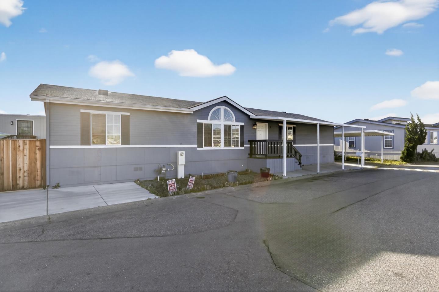 120 Dixon Landing Road, Unit 9 Milpitas, CA 95035 - Photo 9 of 34 a front view of a house with basket ball court and outdoor seating