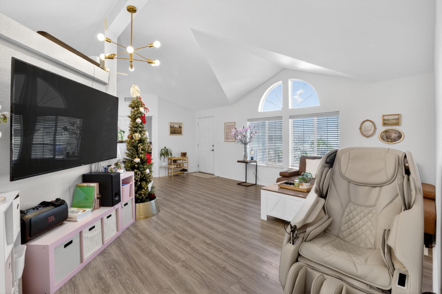 120 Dixon Landing Road, Unit 9 Milpitas, CA 95035 - Photo 10 of 34 a living room with furniture a fireplace and a flat screen tv