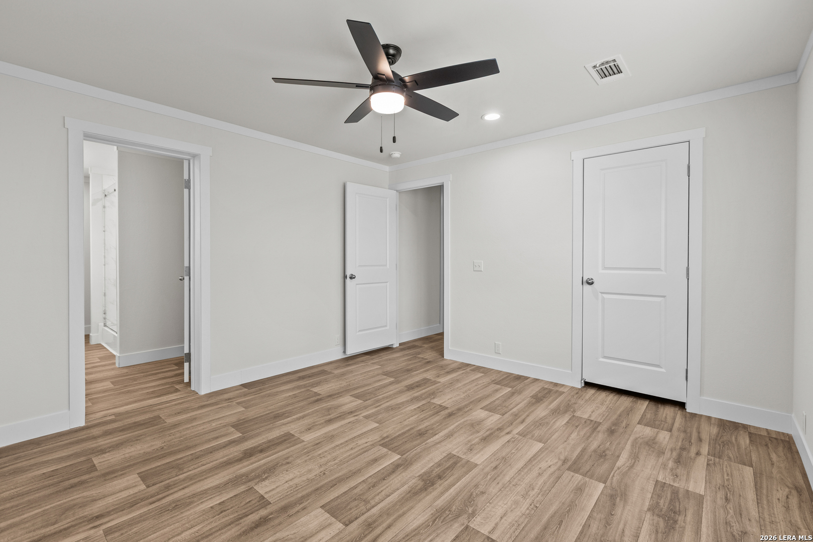 697 County Road 664 Devine, TX 78016 - Photo 14 of 19 a view of an empty room with wooden floor