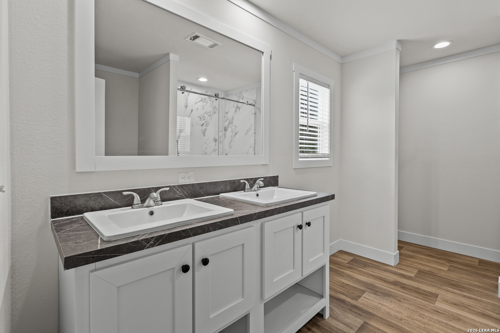 697 County Road 664 Devine, TX 78016 - Photo 15 of 19 a bathroom with a sink and a mirror