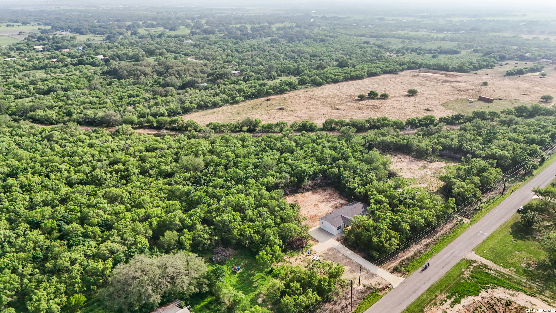697 County Road 664 Devine, TX 78016 - Photo 18 of 19 an aerial view of mountain with yard