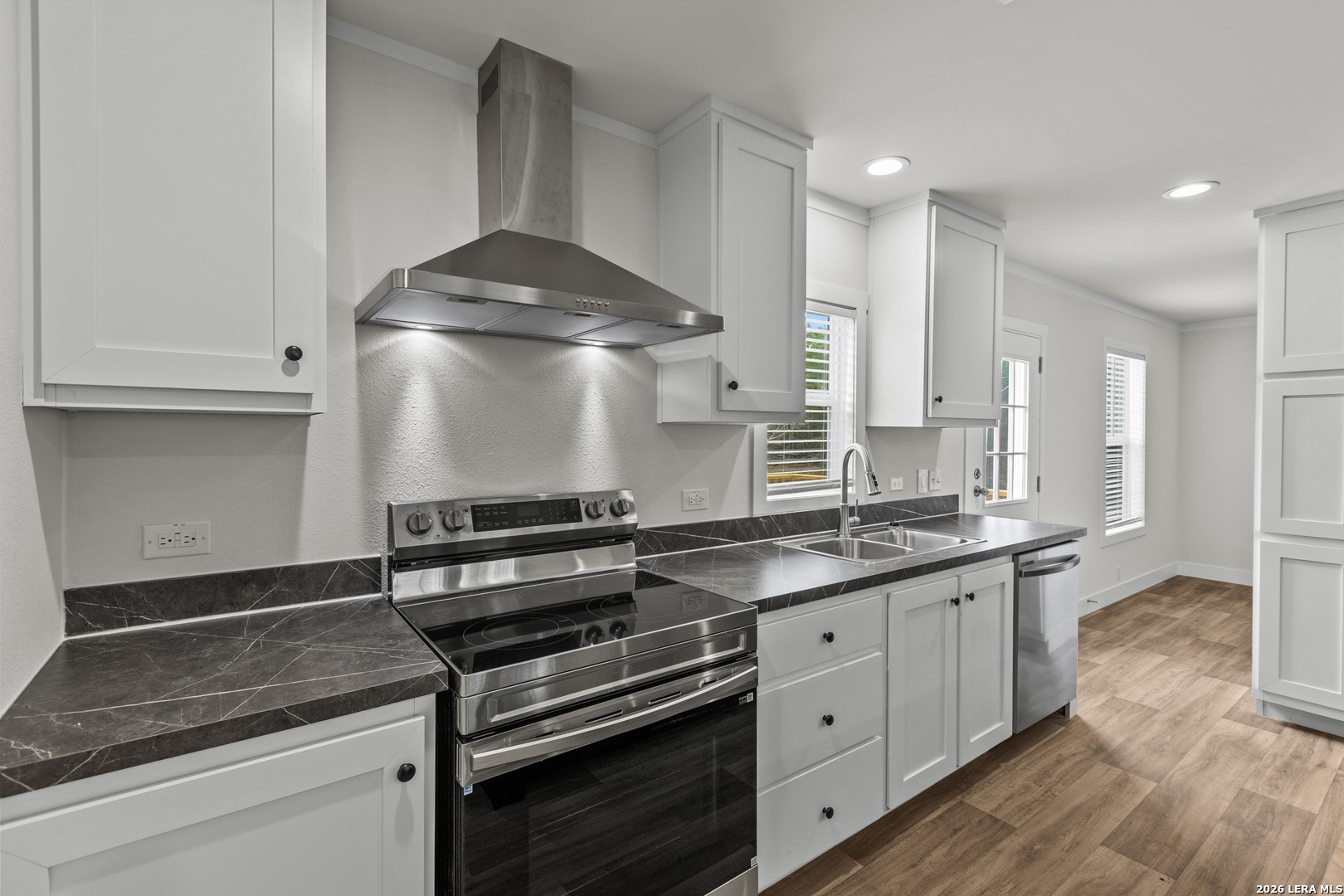 697 County Road 664 Devine, TX 78016 - Photo 6 of 19 a kitchen with stainless steel appliances granite countertop a stove and a granite counter tops