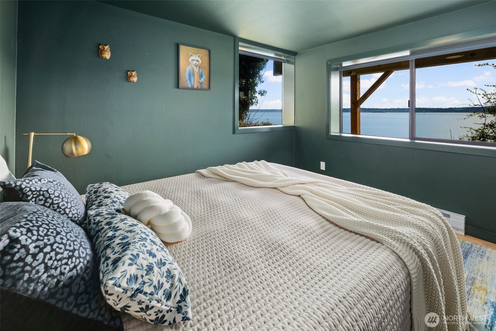28605 Manzanita Beach Road Southwest Vashon, WA 98070 - Photo 24 of 39 a bedroom with a bed and a window
