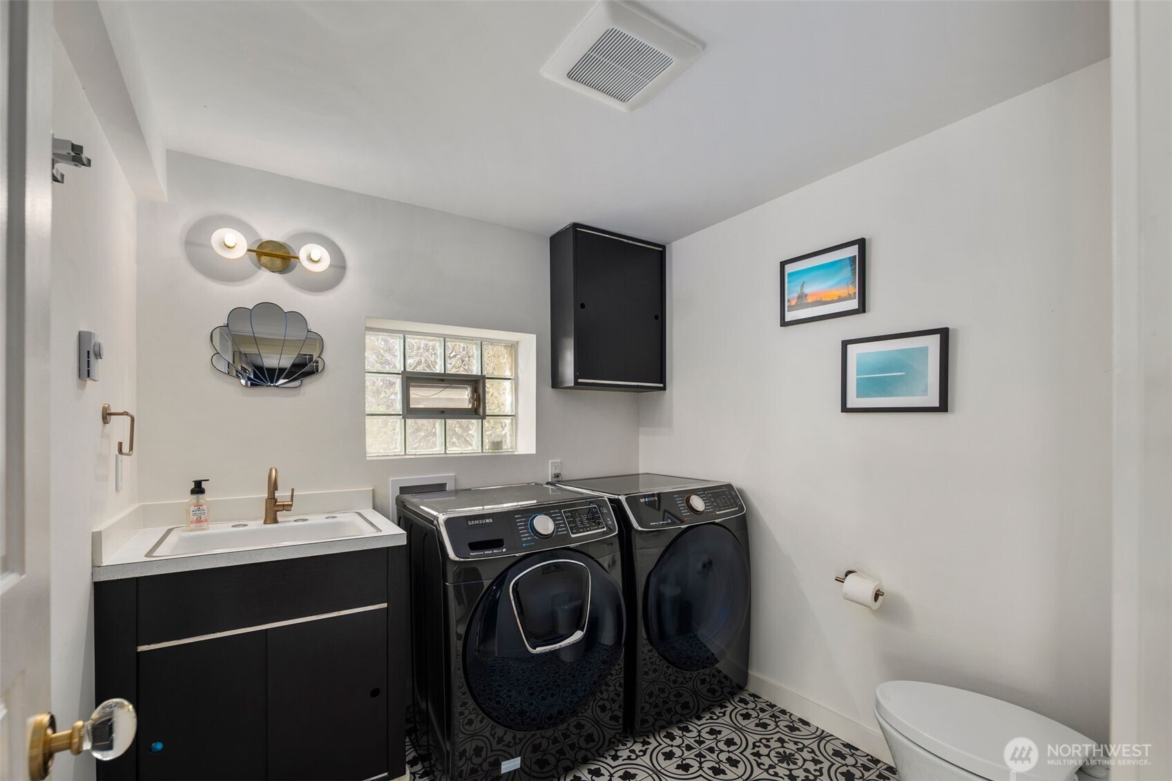 28605 Manzanita Beach Road Southwest Vashon, WA 98070 - Photo 28 of 39 a bathroom with a sink mirror and toilet