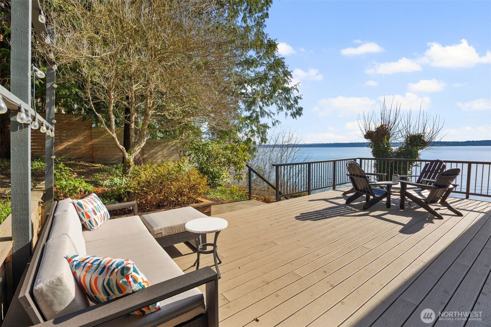 28605 Manzanita Beach Road Southwest Vashon, WA 98070 - Photo 30 of 39 a view of a patio with table and chairs and wooden floor