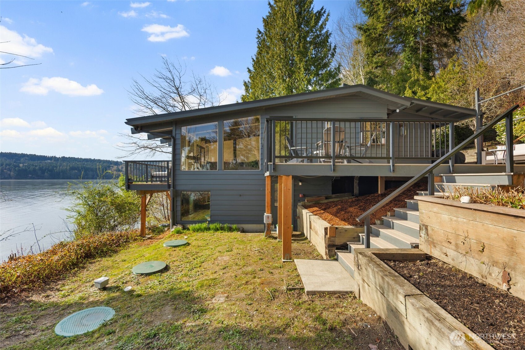 28605 Manzanita Beach Road Southwest Vashon, WA 98070 - Photo 39 of 39 a house with trees in the background