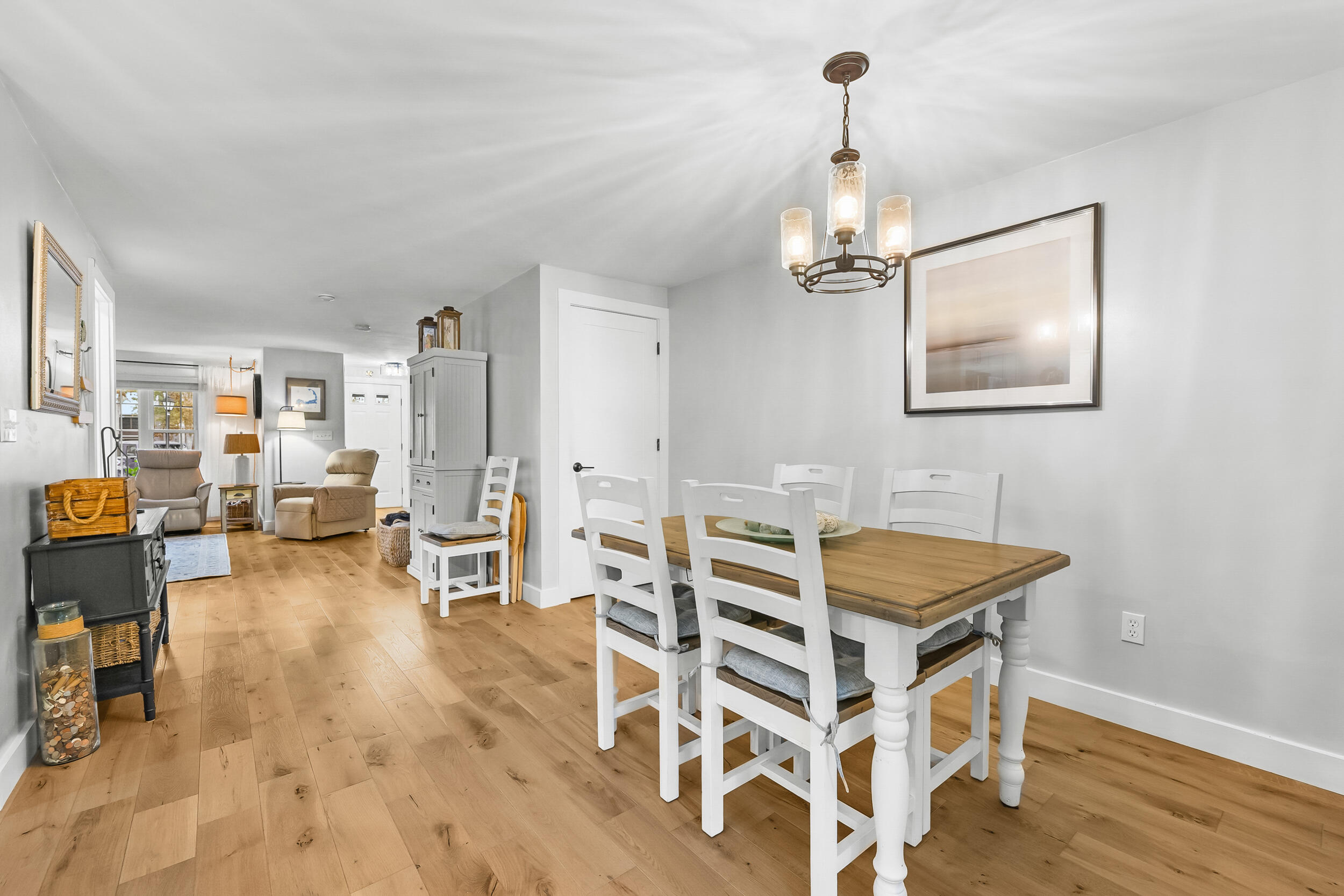 195 Falmouth Road, Unit 7B Mashpee, MA 02649 - Photo 11 of 38 a view of a livingroom with furniture and wooden floor