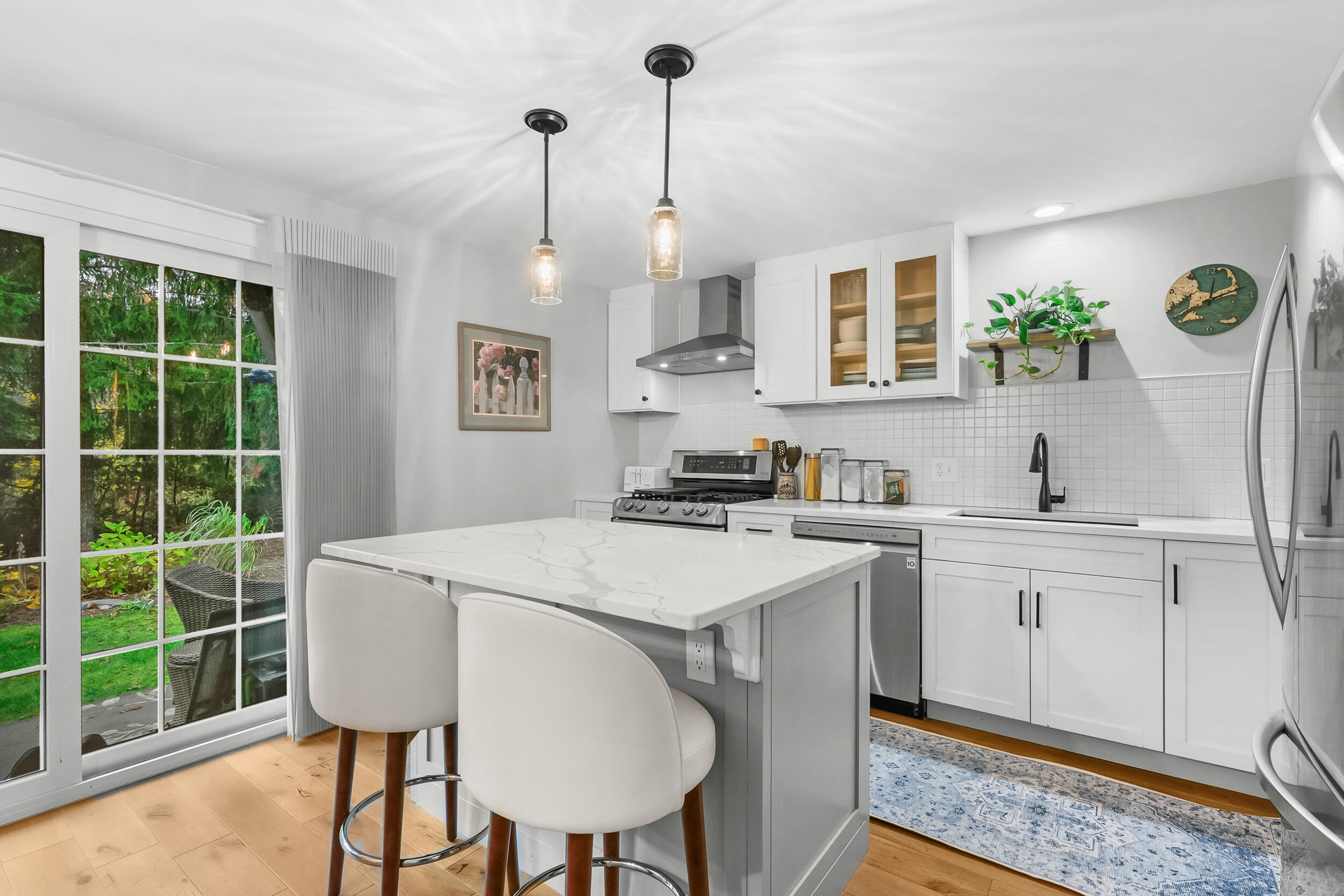 195 Falmouth Road, Unit 7B Mashpee, MA 02649 - Photo 12 of 38 a kitchen that has a cabinets a sink and a stove in it