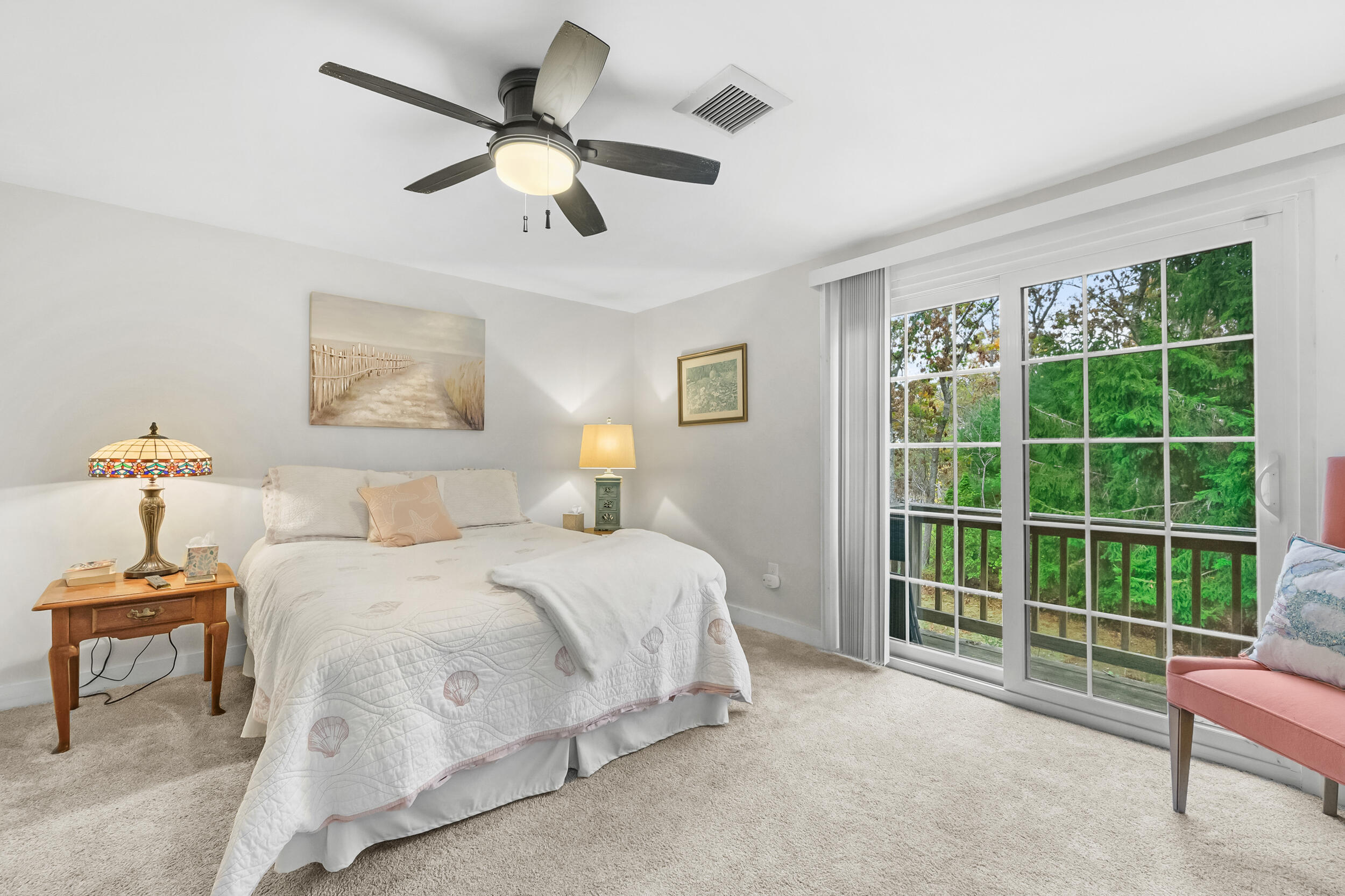 195 Falmouth Road, Unit 7B Mashpee, MA 02649 - Photo 20 of 38 a bedroom with a bed and a large window